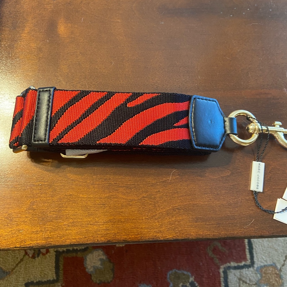 Marc Jacobs purse guitar strap. Red and black with gold tone hardware.